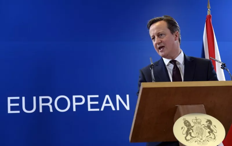 British Prime Minister David Cameron talks to the media at the end of a European Union Summit held at the EU Council building in Brussels on March 20, 2015.  AFP PHOTO / THIERRY CHARLIER