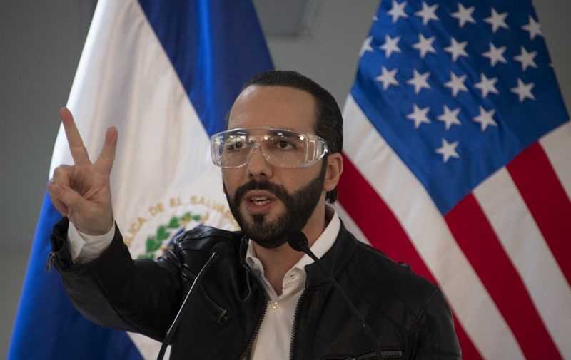 (FILES) In this file photo taken on May 26, 2020 El Salvador's president Nayib Bukele, accompanied by US Ambassador to El Salvador Ronald Johnson (out of frame), speaks during a joint press conference at Rosales Hospital in San Salvador. - El Salvador's top court said on September 3, 2021 that populist President Nayib Bukele would be allowed to run for a second term, despite the country's constitution prohibiting the head of state from serving two consecutive terms in office. The dresolution was condemned by the US government on September 4. (Photo by Yuri CORTEZ / AFP)