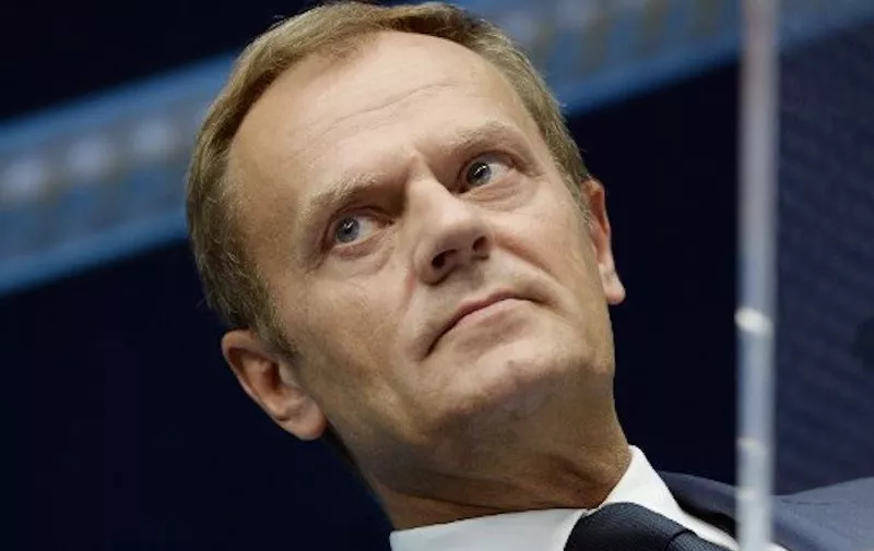 European Union Council President Donald Tusk addresses journalists at the end of a European Summit at the EU Council building in Brussels on June 26, 2015. AFP PHOTO / Thierry Charlier