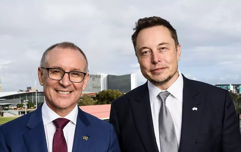 A handout photo taken and received on July 7, 2017, shows South Australia's Premier Jay Weatherill (L) and Tesla Motors CEO Elon Musk (R) at an announcement in Adelaide.
Elon Musk's Tesla said it will build what the maverick entrepreneur claims is the world's largest lithium ion battery within 100 days, making good on a Twitter promise to ease South Australia's energy woes.  "This system will be three times more powerful than any system on Earth," Musk told reporters in the state capital Adelaide. / AFP PHOTO / SOUTH AUSTRALIA DEPARTMENT OF PREMIER AND CABINET / Handout / ----EDITORS NOTE ----RESTRICTED TO EDITORIAL USE MANDATORY CREDIT " AFP PHOTO / SOUTH AUSTRALIA DEPARTMENT OF PREMIER AND CABINET" NO MARKETING NO ADVERTISING CAMPAIGNS - DISTRIBUTED AS A SERVICE TO CLIENTS