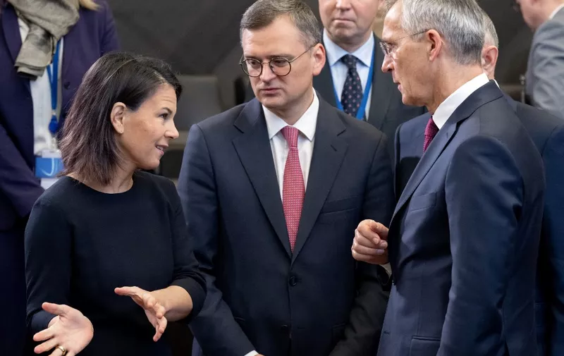 German Minister of Foreign Affairs Annalena Baerbock (L) speaks with Ukrainian Minister for Foreign Affairs Dmytro Kuleba (C) and Nato Secretary General Jens Stoltenberg (R) prior to the Nato Foreign Ministers meeting on Ukraine at Nato Headquarters in Brussels, on November 29, 2023. (Photo by SAUL LOEB / POOL / AFP)