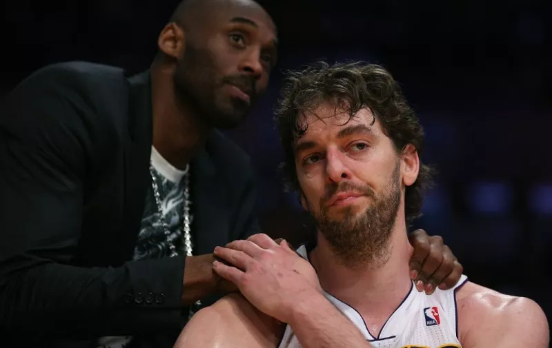 LOS ANGELES, CA - APRIL 28: Pau Gasol #16 of the Los Angeles Lakers is consoled by Kobe Bryant after coming out of the game in the second half against the San Antonio Spurs during Game Four of the Western Conference Quarterfinals of the 2013 NBA Playoffs at Staples Center on April 28, 2013 in Los Angeles, California. The Spurs defeated the Lakers 103-82. NOTE TO USER: User expressly acknowledges and agrees that, by downloading and or using this photograph, User is consenting to the terms and conditions of the Getty Images License Agreement.   Jeff Gross/Getty Images)thx