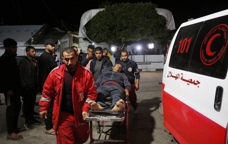 DEIR AL BALAH, GAZA - MARCH 15: Injured Palestinians, including children, are brought to Al-Aqsa Martyrs Hospital for treatment after an Israeli attacks on al-Maghazi Refugee Camp in Deir al-Balah, Gaza on March 15, 2024. Ashraf Amra / Anadolu (Photo by ashraf amra / ANADOLU / Anadolu via AFP)
