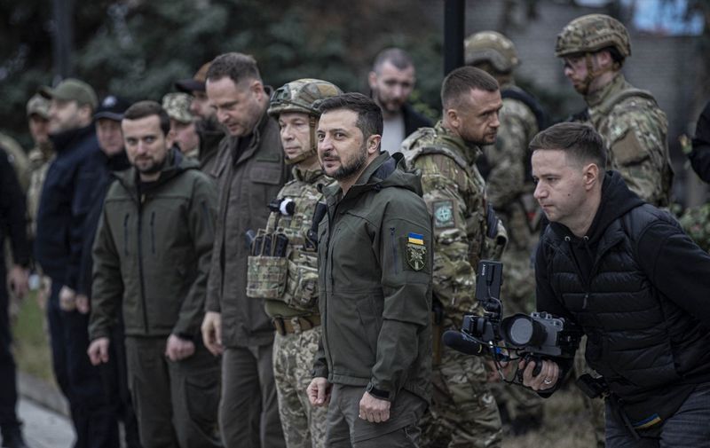 IZIUM, KHARKIV, UKRAINE - SEPTEMBER 14: Ukrainian President Volodymyr Zelenskyy attends flag hoisting ceremony in Izium after the Ukrainian forces took control of the city from the Russian forces in Kharkiv, Ukraine on September 14, 2022. Commander of the Ukrainian Land Forces Oleksandr Syrskyi, Head of the Presidential Office Andriy Yermak, Governor of the Military Administration of the Kharkiv Region Oleg Sinegubov also attended the ceremony. Metin Aktaş / Anadolu Agency (Photo by Metin Aktaş / ANADOLU AGENCY / Anadolu via AFP)