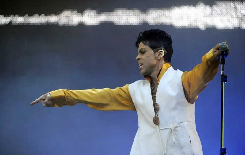 US singer and musician Prince (born Prince Rogers Nelson) performs on stage at the Stade de France in Saint-Denis, outside Paris, on June 30, 2011. AFP PHOTO BERTRAND GUAY / AFP PHOTO / BERTRAND GUAY