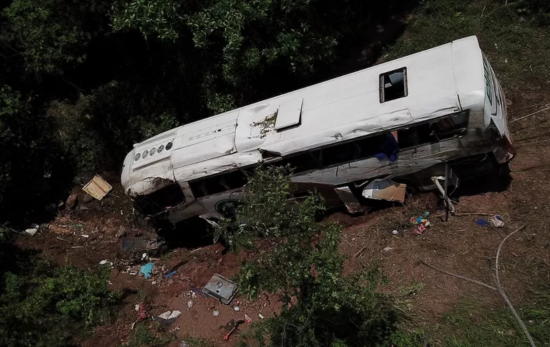 The aerial shot shows the area where a bus crashed on the Nayarit to Mazatlan highway resulting in 18 people dead and 22 injured in Tepic , Nayarit state, Mexico, on August 3, 2023. At least 18 people were killed and at least 23 injured Thursday when a bus carrying foreign migrants and locals plummeted into a ravine in northwestern Mexico, authorities said. (Photo by Ulises Ruiz / AFP)