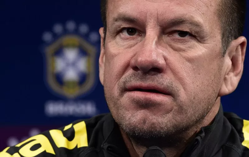 Brazil's head coach Dunga, gives a press conference on March 25, 2015, on the eve of the team's friendly football match against France at the Stade de France in Saint-Denis, north of Paris. AFP PHOTO / FRANCK FIFE