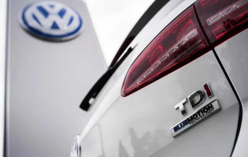 A Golf diesel car is seen at a Volkswagen dealer in Berlin on September 22, 2015.  In an affair that originally broke on Friday and has unfolded rapidly since then, VW has forced to admit on Tuesday that 11 million of its diesel cars all around the world are equipped with devices that can cheat pollution test.   AFP PHOTO / ODD ANDERSEN