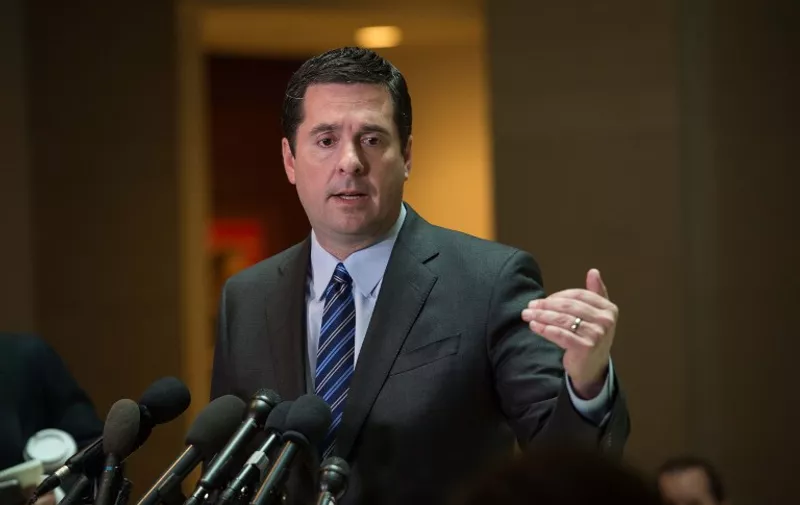 (FILES) This file photo taken on March 24, 2017 shows US Representative from California Devin Nunes, chairman of the House Intelligence Committee,as he speaks to the press about the investigation of Russian meddling in the 2016 presidential election on Capitol Hill in Washington, DC.
The Republican leader of the House investigation into Russian interference in the US election announced on April 6, 2017 he was stepping aside after being criticized for being too close to President Donald Trump. Devin Nunes, the chairman of the House Intelligence Commitee, had come under fire for briefing Trump on information he had received while keeping members of his own committee in the dark.
 / AFP PHOTO / NICHOLAS KAMM
