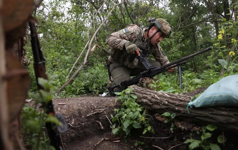 A Ukrainian soldier of the 28th Separate Mechanized Brigade holds his positions at the front line near the town of Bakhmut, Donetsk region, on June 17, 2023, amid the Russian invasion of Ukraine. (Photo by Anatolii STEPANOV / AFP)