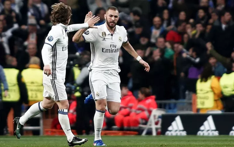 MADRID, SPAIN &#8211; FEBRUARY 15: Karim Benzema (R) of Real Madrid celebrates with Luka Modric (L) after scoring a goal during the UEFA Champions League round of 16 match between Real Madrid and Napoli at Santiago Bernabeu Stadium in Madrid, Spain on February 15, 2017. Burak Akbulut / Anadolu Agency, Image: 321110719, License: Rights-managed, Restrictions: [&hellip;]