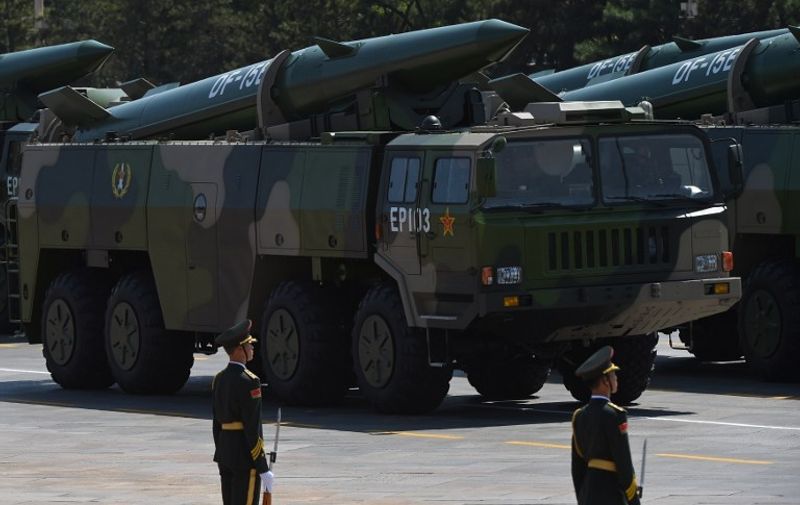 Military vehicles carrying DF-15B ballistic missiles participate in a military parade at Tiananmen Square in Beijing on September 3, 2015, to mark the 70th anniversary of victory over Japan and the end of World War II. China kicked off a huge military ceremony marking the 70th anniversary of Japan's defeat in World War II on September 3, as major Western leaders stayed away. AFP PHOTO / GREG BAKER / AFP PHOTO / GREG BAKER