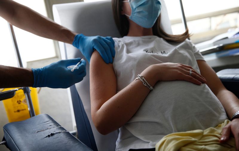 A pregnant woman receives the Covid-19 vaccine at Gemelli hospital in Rome, Italy on Oct. 25, 2021. Nascere protetti (Born Safely) a day dedicated to bring awareness to pregnancy and the Covid-19 vaccine.,Image: 639997972, License: Rights-managed, Restrictions: *** World Rights Except China, France, and Italy ***, Model Release: no, Credit line: Profimedia