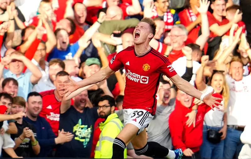 Manchester United's Scott McTominay celebrates scoring his side's second goal during the English Premier League soccer match between Manchester United and Brentford at the Old Trafford stadium in Manchester, England, Saturday, Oct. 7, 2023.(AP Photo/Jon Super)