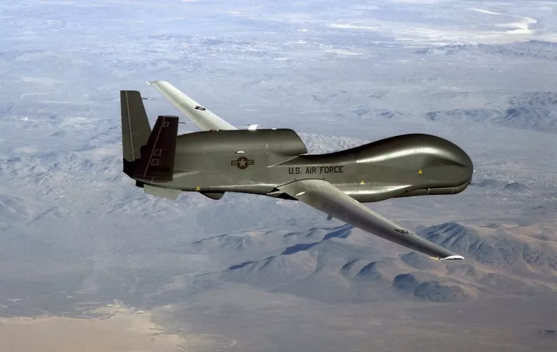 This undated US Air Force file photo released on June 20, 2019 shows a photo of a RQ-4 Global Hawk unmanned surveillance and reconnaissance aircraft. - A US spy drone was some 34 kilometers (21 miles) from the nearest point in Iran when it was shot down over the Strait of Hormuz by an Iranian surface-to-air missile June 20, 2019, a US general said. "This dangerous and escalatory attack was irresponsible and occurred in the vicinity of established air corridors between Dubai, UAE, and Oman, possibly endangering innocent civilians," said Lieutenant General Joseph Guastella, who commands US air forces in the region."At the time of the intercept the RQ-4 was at high altitude, approximately 34 kilometers from the nearest point of land on the Iranian coast," he said, over a video to the Pentagon press briefing room. (Photo by Handout / US AIR FORCE / AFP) / RESTRICTED TO EDITORIAL USE - MANDATORY CREDIT "AFP PHOTO / US AIR FORCE/HANDOUT" - NO MARKETING - NO ADVERTISING CAMPAIGNS - DISTRIBUTED AS A SERVICE TO CLIENTS