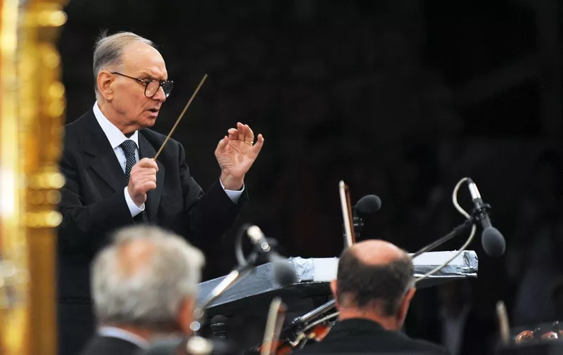 Italian composer and conductor Ennio Morricone performs at the opening concert of the 49th Ohrid summer festival at the Antique Theatre in Ohrid July 12, 2009. Morricone arrived in Macedonia with musicians of the Budapest Symphonic Orchestra.        AFP PHOTO/ROBERT ATANASOVSKI (Photo by ROBERT ATANASOVSKI / AFP)