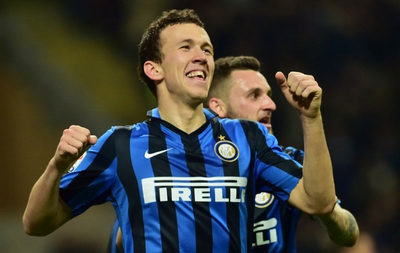 Inter Milan's forward from Croatia Ivan Perisic celebrates after scoring a goal during the Italian Serie A football match between Inter Milan and Bologna at the San Siro Stadium in Milan on March 12, 2016. / AFP / GIUSEPPE CACACE