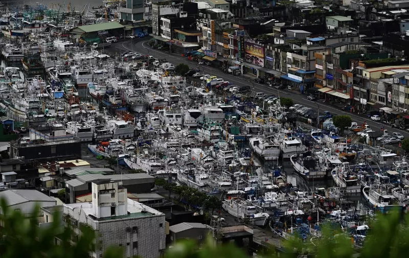 This overview shows fishing boats packed into the typhoon shelter at Nanfangao harbour in Suao, Yilan county, as Typhoon Lekima approaches off the shores of eastern Taiwan on August 8, 2019. (Photo by Sam YEH / AFP)