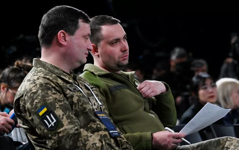 Head of Ukraine's Military Intelligence Kyrylo Budanov (R) and spokesperson Andriy Yusov (L) attend the "Ukraine Year 2024" forum in Kyiv on February 25, 2024. Enigmatic and unflappable, spy chief Kyrylo Budanov has built up a legendary reputation in Ukraine with a series of daring operations against Russia. Referred to as the man "without a smile" by Ukrainian news outlet NV, the 38-year-old is credited with attacks in occupied areas and deep inside Russia. (Photo by Sergei SUPINSKY / AFP)