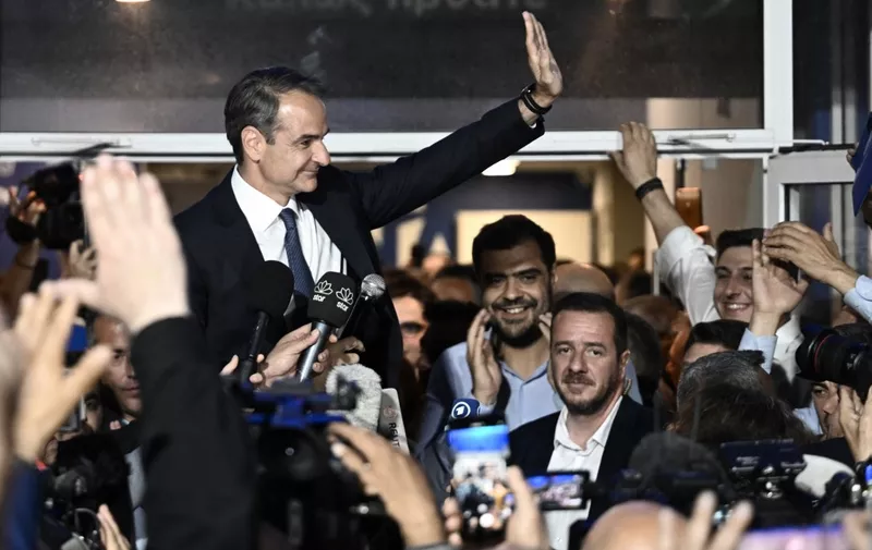 Prime Minister and New Democracy party's leader Kyriakos Mitsotakis looks on as he celebrates with his supporters after his party's victory in elections in Athens, on May 21, 2023. Greek Prime Minister Kyriakos Mitsotakis' conservatives scored a resounding but indecisive victory in Sunday's election, early results showed. With a third of polling stations accounted for, the New Democracy party had an 21-point lead over its nearest rival, but failed to muster enough support for an outright victory. (Photo by Aris Messinis / AFP)