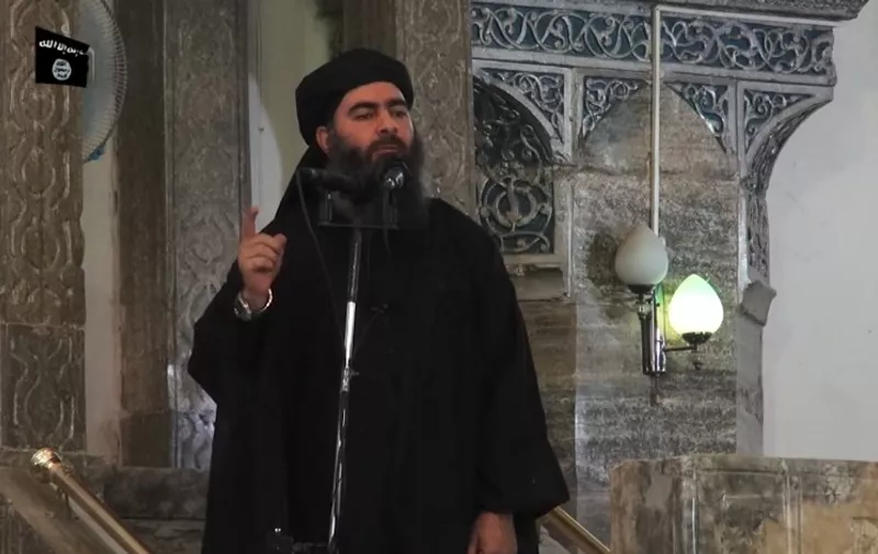 (FILES) - A file image grab taken from a propaganda video released on July 5, 2014 by al-Furqan Media allegedly shows the leader of the Islamic State (IS) jihadist group, Abu Bakr al-Baghdadi, aka Caliph Ibrahim, adressing Muslim worshippers at a mosque in the militant-held northern Iraqi city of Mosul. Al-Baghdadi rose from obscurity to lead the world's most infamous and feared jihadist group, but shuns the spotlight for an aura of mystery that adds to his appeal. AFP PHOTO / HO / AL-FURQAN MEDIA 
== RESTRICTED TO EDITORIAL USE - MANDATORY CREDIT "AFP PHOTO / HO / AL-FURQAN MEDIA " - NO MARKETING NO ADVERTISING CAMPAIGNS - DISTRIBUTED AS A SERVICE TO CLIENTS FROM ALTERNATIVE SOURCES, AFP IS NOT RESPONSIBLE FOR ANY DIGITAL ALTERATIONS TO THE PICTURE'S EDITORIAL CONTENT, DATE AND LOCATION WHICH CANNOT BE INDEPENDENTLY VERIFIED ==