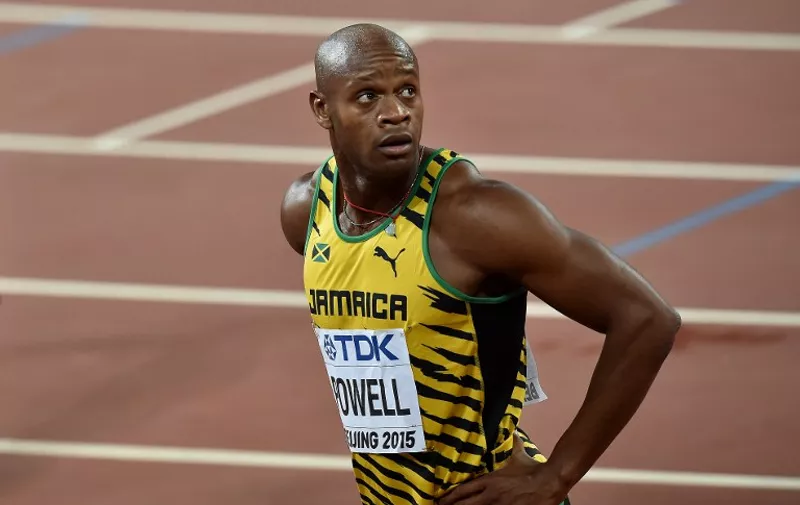 Jamaica's Asafa Powell reacts after the heat of the men's 100 metres athletics event at the 2015 IAAF World Championships at the "Bird's Nest" National Stadium in Beijing on August 22, 2015.   AFP PHOTO / PEDRO UGARTE