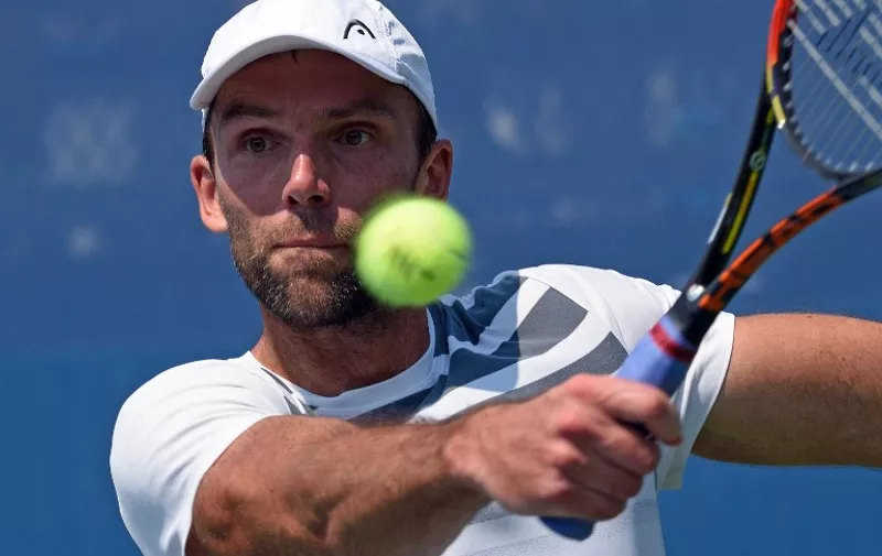 Ivo Karlovic of Croatia hits a return to Federico Delbonis of Argentia during their US Open 2015 first round men's singles match at the USTA Billie Jean King National Center September 1, 2015  in New York. AFP PHOTO/DON EMMERT