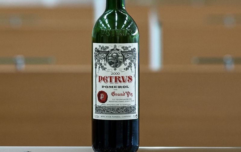(FILES) In this file photo taken on March 1, 2021, a bottle of Petrus that went into space is displayed at the University of Bordeaux Institut des Sciences de la Vigne et du Vin (Institute of Vine &amp; Wine Science) in Villenave-d'Ornon, on the outskirts of Bordeaux, southwestern France. - If a bottle of Petrus 2000 that Christie's is selling tastes out of this world it might be because it aged for 14 months aboard the International Space Station. Christie's hopes the bottle, now up for grabs in a private sale, will fetch $1 million, which would make it the most expensive wine ever sold. The bottle is one of a batch of 12 that European startup Space Cargo Unlimited sent into orbit as part of research into how food and drink matures in space. (Photo by Philippe LOPEZ / AFP)