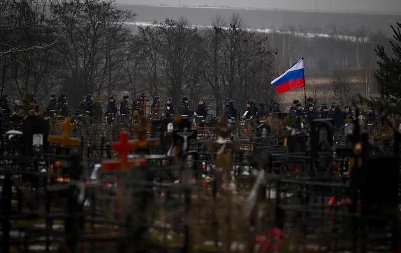 A picture shows a funeral ceremony for a fallen Russian soldier at a cemetery in the town of Bogoroditsk in the Tula region on March 24, 2023. (Photo by Natalia KOLESNIKOVA / AFP)