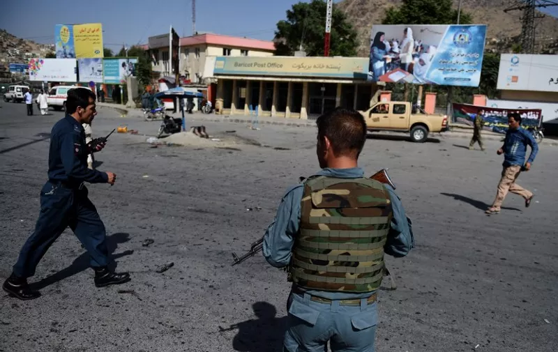 Afghan security personnel arrive after a suicide attack that targeted crowds of minority Shiite Hazaras during a demonstration at the Deh Mazang Circle of Kabul on July 23, 2016.

A powerful explosion on July 23, ripped through crowds of minority Shiite Hazaras in Kabul who had gathered to protest over a power line, killing at least 20 people and leaving 160 others wounded, officials said. No group has so far claimed responsibility for the blast, but it comes in the middle of the Taliban's annual summer offensive, which the insurgents are ramping up after a brief lull during the recent holy fasting month of Ramadan. The scene of the blast was littered with charred bodies and dismembered limbs, with ambulances struggling to reach the scene as authorities had overnight blocked key intersections with stacked shipping containers to impede movement of the protesters. / AFP PHOTO / WAKIL KOHSAR