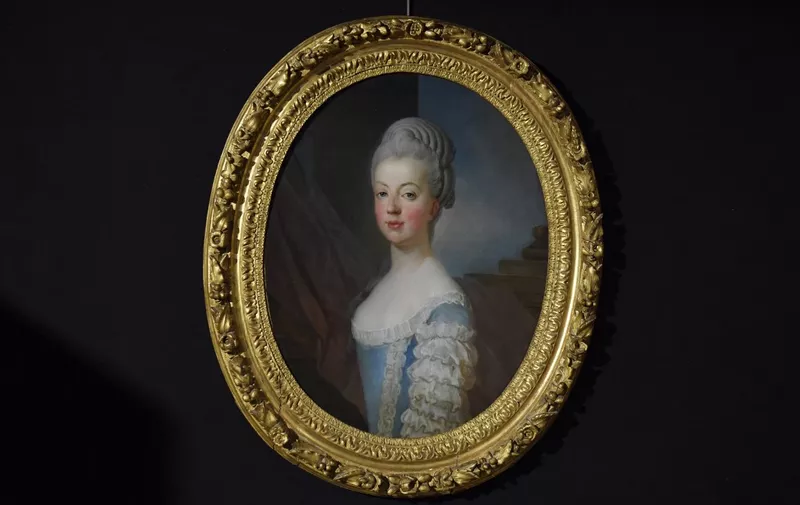 This photograph taken on November 23, 2021, shows the painting "Portrait de la dauphine de France, Marie Antoinette de Lorraine-Habsburg" by painter Joseph Siffried Duplessis &amp; Atelier Carpentras is on display during their presention two days before being auctionned at Auguttes auction house in Neuilly sur Seine near Paris. (Photo by JULIEN DE ROSA / AFP)