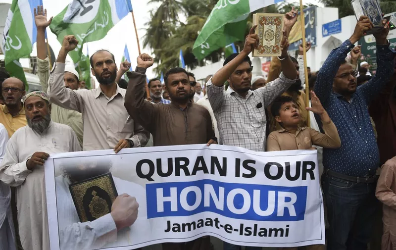 Activists of the right-wing religious Jamaat-e-Islami (JI) party shout slogans during an anti-Sweden demonstration in Karachi on July 5, 2023, following the burning of the Koran outside a Stockholm mosque that outraged Muslims around the world. (Photo by Rizwan TABASSUM / AFP)