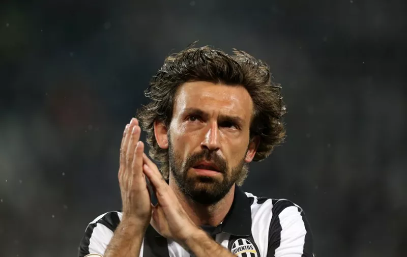 Juventus' midfielder Andrea Pirlo gestures during the Italian Serie A football match between Juventus and Fiorentina on April 29, 2015 at the "Juventus Stadium" in Turin.  AFP PHOTO / MARCO BERTORELLO