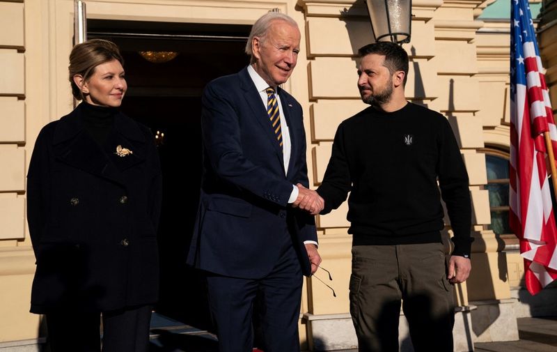 US President Joe Biden (C) meets with Ukrainian President Volodymyr Zelensky (R) and his wife Olena Zelenska at Mariinsky Palace during an unannounced visit in Kyivon February 20, 2023. (Photo by Evan Vucci / POOL / AFP)