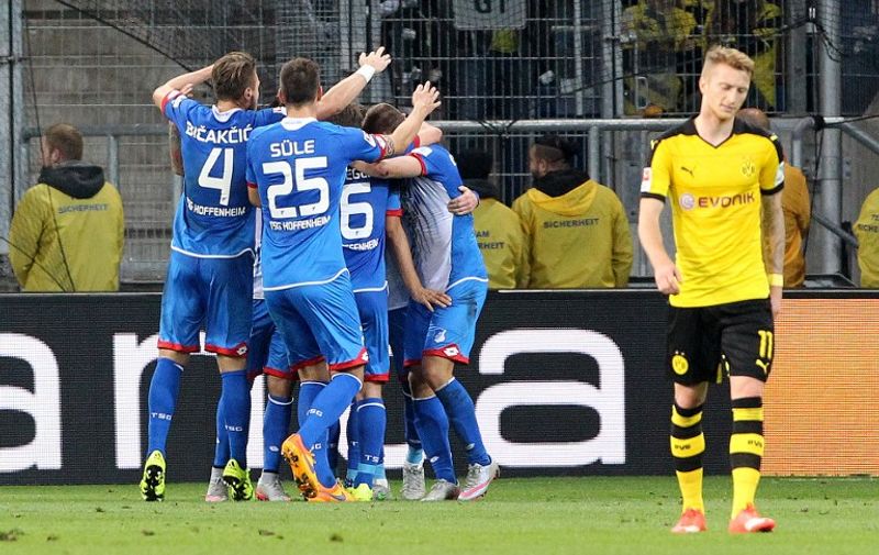 Hoffenheim's players celebrate Hoffenheim's midfielder Sebastian Rudy scoring the 1-0 during the German first division Bundesliga football match TSG 1899 Hoffenheim vs Borussia Dortmund in Sinsheim, on September 23, 2015.    

RESTRICTIONS: DURING MATCH TIME: DFL RULES TO LIMIT THE ONLINE USAGE TO 15 PICTURES PER MATCH AND FORBID IMAGE SEQUENCES TO SIMULATE VIDEO. 
==RESTRICTED TO EDITORIAL USE ==
FOR FURTHER QUERIES PLEASE  CONTACT THE  DFL DIRECTLY AT + 49 69 650050.