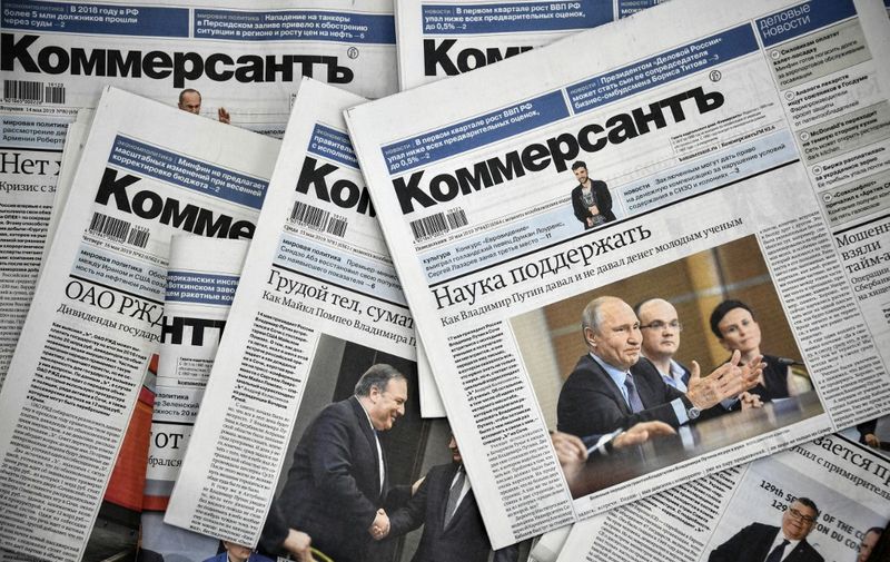 A picture taken on May 20, 2019, shows Kommersant daily newspaper issues. - The entire political desk of one of Russia's top newspapers, Kommersant, quit on May 20, 2019 in protest over censorship after two veteran reporters were fired. (Photo by Alexander NEMENOV / AFP)