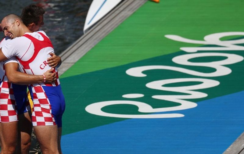 Croatia's Martin Sinkovic (R) and Croatia's Valent Sinkovic celebrate at the end of the Men's Double Sculls final rowing competition at the Lagoa stadium, during the Rio 2016 Olympic Games in Rio de Janeiro on August 11, 2016. / AFP PHOTO / POOL / Patrick Smith