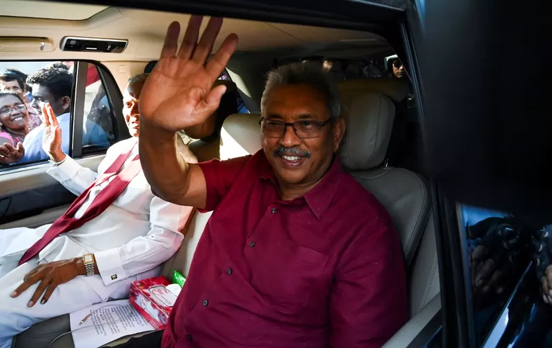 (FILES) In this file photo taken on November 17, 2019, Sri Lanka's President-elect Gotabaya Rajapaksa waves to supporters as he leaves the election commission office in Colombo. - Millions of rupees in cash left behind by President Gotabaya Rajapaksa when he fled his official residence in the capital will be handed over to court on July 11, 2022, police said. (Photo by Ishara S. KODIKARA / AFP)