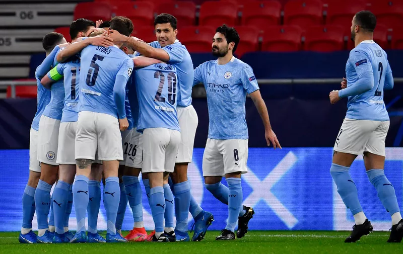 16 March 2021, Hungary, Budapest: Football: Champions League, Manchester City - Borussia M'nchengladbach, knockout round, round of 16, second leg at Puskas Arena. Manchester City's players celebrate the goal for 1:0 by De Bruyne (hidden). Photo by: Marton Monus/picture-alliance/dpa/AP Images