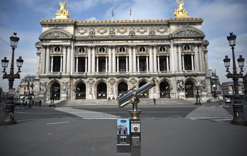 A picture shows the empty square in front of the Palais Garnier opera house in Paris, on March on 17, 2020, while a strict lockdown comes into in effect in France to stop the spread of COVID-19, caused by the novel coronavirus. - A strict lockdown requiring most people in France to remain at home came into effect at midday on March 17, 2020, prohibiting all but essential outings in a bid to curb the coronavirus spread. The government has said tens of thousands of police will be patrolling streets and issuing fines of 38 to 135 euros (42-150 USD) for people without a written declaration justifying their reasons for being out. (Photo by Lionel BONAVENTURE / AFP)