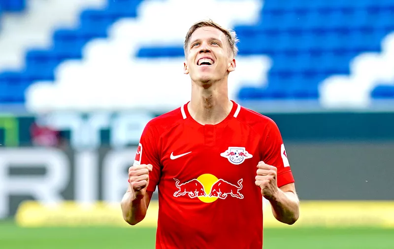 SINSHEIM, GERMANY - JUNE 12: Dani Olmo of Leipzig celebrates after scoring his sides second goal during the Bundesliga match between TSG 1899 Hoffenheim and RB Leipzig at PreZero-Arena on June 12, 2020 in Sinsheim, Germany. (Photo by Uwe Anspach/Pool via Getty Images)