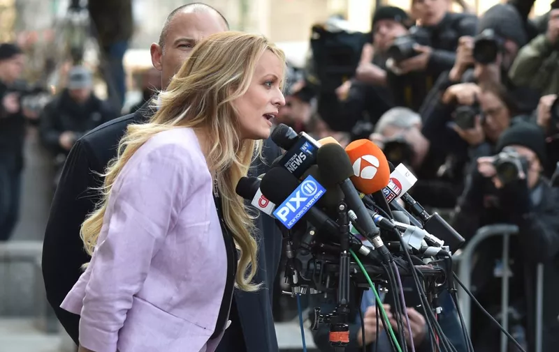 Adult-film actress Stephanie Clifford, also known as Stormy Daniels speaks to the media  outside US Federal Court on April 16, 2018, in Lower Manhattan, New York. - President Donald Trump's personal lawyer Michael Cohen has been under criminal investigation for months over his business dealings, and FBI agents last week raided his home, hotel room, office, a safety deposit box and seized two cellphones. Some of the documents reportedly relate to payments to porn star Stormy Daniels, who claims a one-night stand with Trump a decade ago, and ex Playboy model Karen McDougal who also claims an affair. (Photo by HECTOR RETAMAL / AFP)