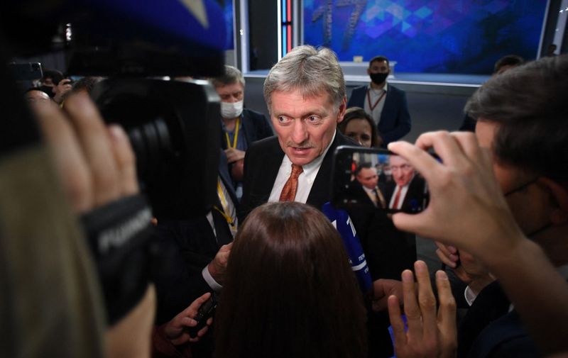 Kremlin spokesman Dmitry Peskov meets with journalists after Russian President Vladimir Putin's annual press conference at the Manezh exhibition hall in central Moscow on December 23, 2021. (Photo by NATALIA KOLESNIKOVA / AFP)