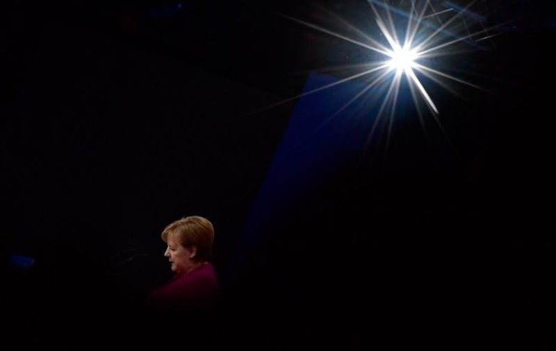 (FILES) In this file photo taken on February 26, 2018 German Chancellor and leader of the conservative Christian Democratic Union (CDU) party Angela Merkel welcomes delegates for the CDU's party congress in Berlin. - German Chancellor Angela Merkel will not stand again as leader of her centre-right CDU, which she has chaired the CDU for 18 years, a party source told AFP on October 29, 2018, making way after 18 years for a successor following a series of regional vote defeats. (Photo by Tobias SCHWARZ / AFP)