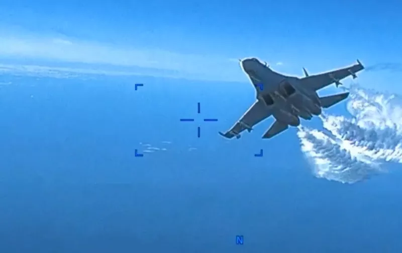 Handout - The US military's European Command has released footage of the Tuesday encounter between a US surveillance drone and a Russian fighter jet as it played out over the Black Sea. The newly declassified video depicts critical moments in the mid-air encounter, which the Pentagon said lasted 30-40 minutes. The video shows the camera of the MQ-9 Reaper drone pointed backward toward its tail and the drone’s propeller, which is mounted on the rear, spinning. Then, a Russian Sukhoi SU-27 fighter jet is shown approaching. As it draws closer, the Russian fighter dumps fuel as it intercepts the US drone. In another portion of the footage, the Russian jet makes another pass. As it approaches, it again dumps fuel. The video from the drone is then disrupted as the Russian fighter jet collides with the MQ-9 Reaper, damaging the propeller and ultimately forcing the US to bring down the drone in the Black Sea. Russia has denied that a collision occurred. When the camera comes back online in the footage, the view is again pointed backward, and the propeller is shown damaged from the collision. Video grab U.S. European Command via ABACAPRESS.COM,Image: 763179696, License: Rights-managed, Restrictions: ***
HANDOUT image or SOCIAL MEDIA IMAGE or FILMSTILL for EDITORIAL USE ONLY! * Please note: Fees charged by Profimedia are for the Profimedia's services only, and do not, nor are they intended to, convey to the user any ownership of Copyright or License in the material. Profimedia does not claim any ownership including but not limited to Copyright or License in the attached material. By publishing this material you (the user) expressly agree to indemnify and to hold Profimedia and its directors, shareholders and employees harmless from any loss, claims, damages, demands, expenses (including legal fees), or any causes of action or allegation against Profimedia arising out of or connected in any way with publication of the material. Profimedia does not claim any copyright or license in the attached materials. Any downloading fees charged by Profimedia are for Profimedia's services only. * Handling Fee Only 
***, Model Release: no