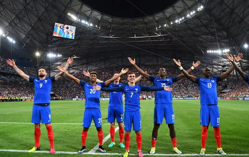 From left: France's forward Olivier Giroud, forward Kingsley Coman, defender Laurent Koscielny,  forward Antoine Griezmann, midfielder Paul Pogba, France's defender Eliaquim Mangala celebrate after beating Germany 2-0 in the Euro 2016 semi-final football match between Germany and France at the Stade Velodrome in Marseille on July 7, 2016.
France will face Portugal in the Euro 2016 finals on July 10, 2016. / AFP PHOTO / FRANCK FIFE