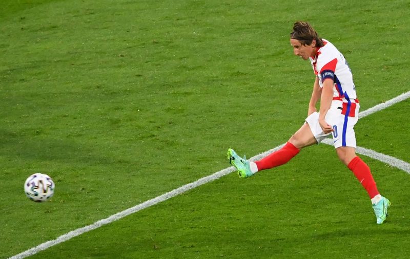 Croatia's midfielder Luka Modric shoots to score the second goal during the UEFA EURO 2020 Group D football match between Croatia and Scotland at Hampden Park in Glasgow on June 22, 2021. (Photo by ANDY BUCHANAN / POOL / AFP)