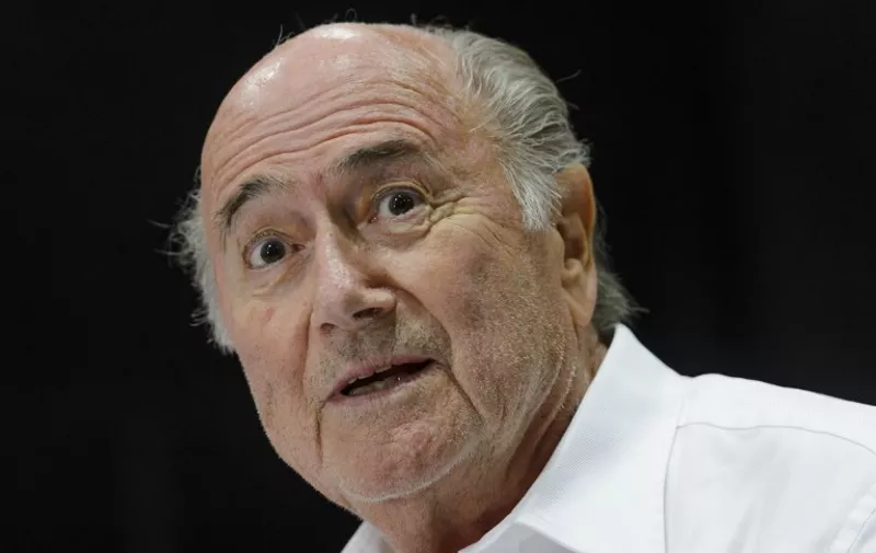 Outgoing FIFA president Sepp Blatter answers to a press conference during the "Sepp Blatter Tournament" on August 22, 2015 in Ulrichen, Blatter's hometown. When Blatter was elected FIFA President in 1998, the town awarded him with the "honorary burgher" of Ulrichen title and to commemorate the occasion, a football tournament bearing his name was created.  AFP PHOTO / FABRICE COFFRINI / AFP / FABRICE COFFRINI