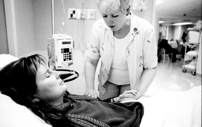 Mary Pocock receives therapeutic touch from Maureen Smith. It's a moment of prayer for both women. Pocock's breast cancer has metastasized and she spends four hours a week in chemotherapy daycare at Princess Margaret Hospital. Doctors tell Pocock people with metastatic breast cancer usually live two years. "But that's their reality," Pocock said. My reality is that I have no idea."