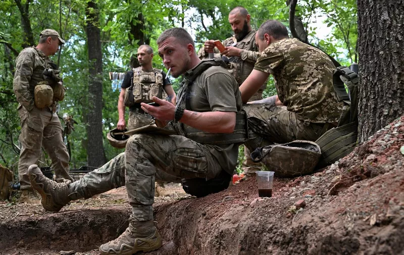 Ukrainian artillerymen get a rest at their position near Avdiivka in the Donetsk region on June 23, 2023, amid the Russian invasion of Ukraine. (Photo by Genya SAVILOV / AFP)